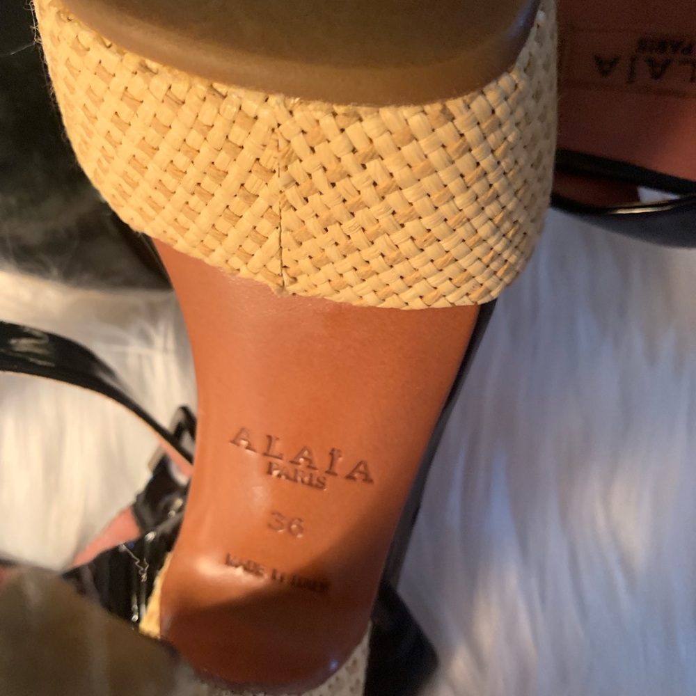 A. Alaia Paris. Black patent leather.